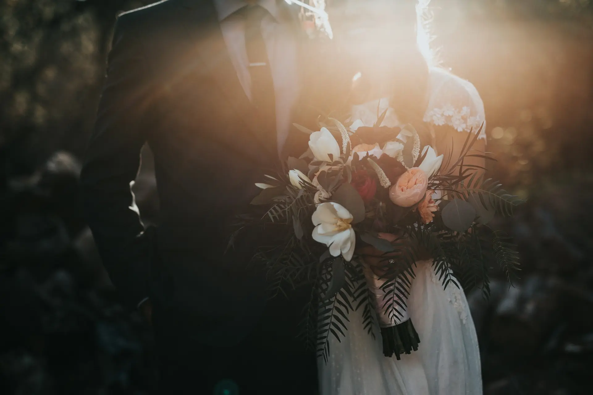 Officiant leading a wedding ceremony with hands raised in blessing